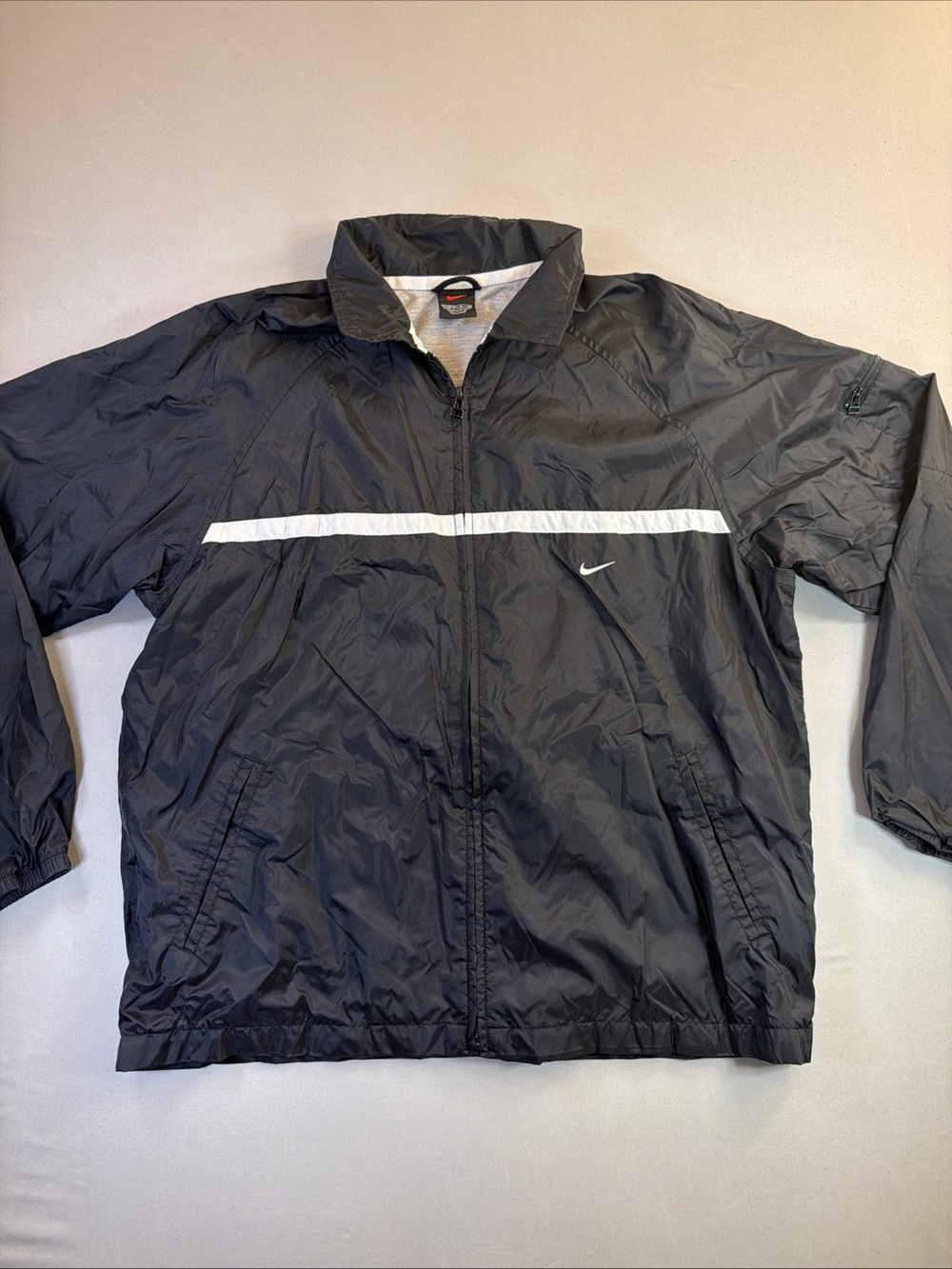 Vintage Nike Black Windbreaker with White Chest Stripe and Small Swoosh